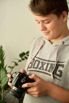 A boy with camera in his hands 스톡 사진