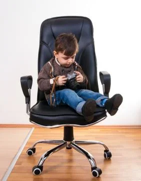 Boy with camera Stock Photos