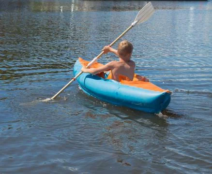 Boy in canoe Stock Photos