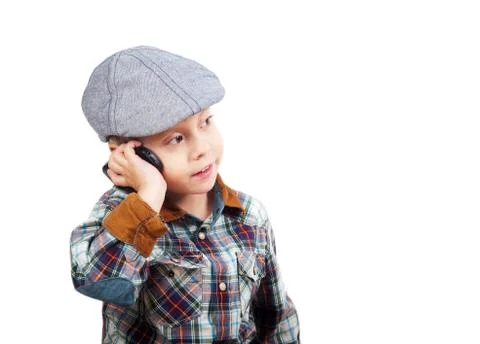Boy in a cap on the phone Stock Photos