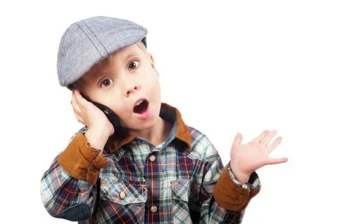 Boy in a cap on the phone Stock Photos
