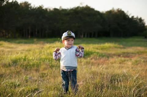 Boy captain sailor spring forest funny smile joy laughter kid Foto stock