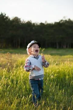 Boy captain sailor spring forest funny smile joy laughter kid Foto stock