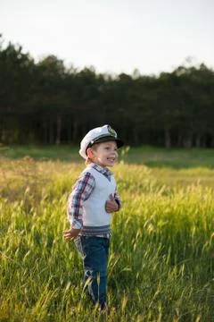 Boy captain sailor spring forest funny smile joy laughter kid Foto stock