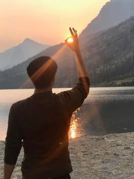 Boy Capturing Sunset Stock Photos