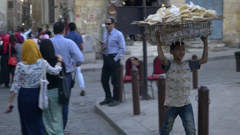 Boy Carrying Bread Inside Khan el-Khalili Market In Cairo, Egypt Stock Footage 157994687