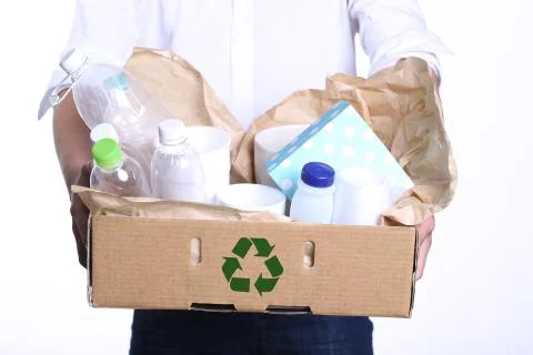 Boy carrying a container bin of cans and bottles Stock Photos