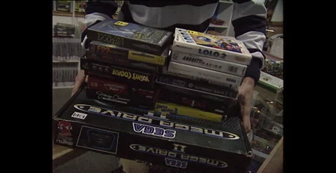 Boy Carrying Gaming Boxes Toward Camera – Australia (1990s) Stock Footage 310221367