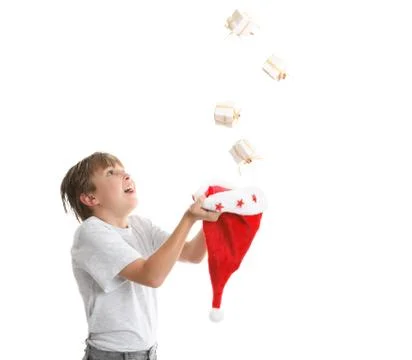Boy catching falling presents Stock Photos