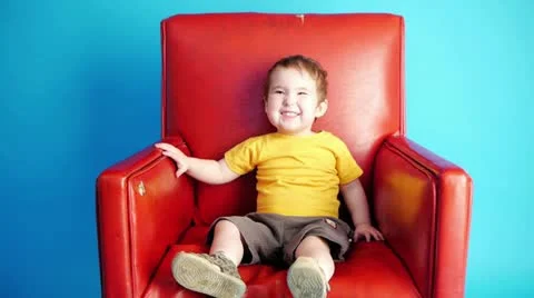 Boy in a chair Stock Footage 20634664