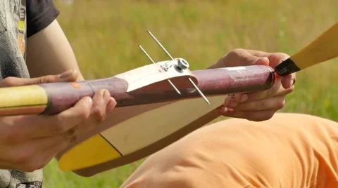 Boy is Checking an Aircraft Propeller Rubber Model Sports Competition Young Stock Footage 64580596
