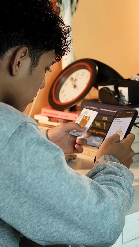 A boy is checking gold price charts on a smartphone Stock Footage 321716730