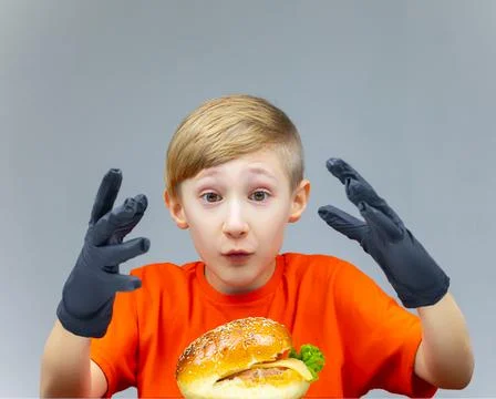 The boy with the cheeseburgers Stock Photos