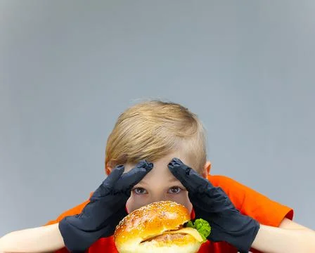 The boy with the cheeseburgers Stock Photos