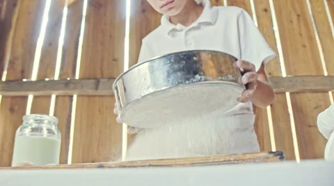 Boy with chef hat cooking something in the house Stock Footage