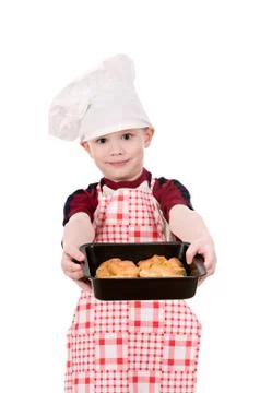 Boy in chef's hat with baking Stock Photos