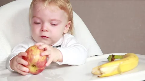 The boy chews an Apple Stock Footage 138698587
