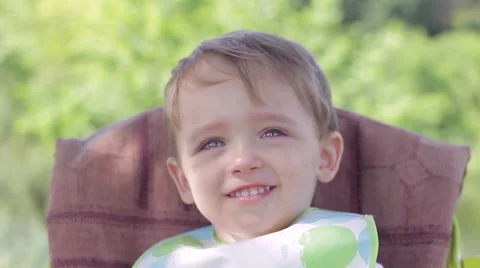 Boy child crying and laughing at the table Video stock 65246949