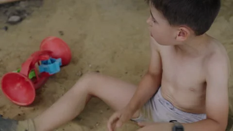 Boy child playing in sandbox. Recreation on playground. Stock Footage 265877751
