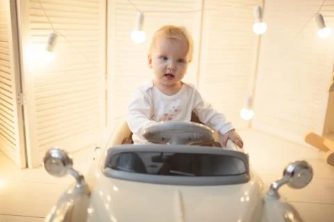 The boy in the children's machine. Stock-Fotos