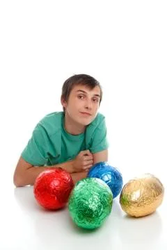 Boy with chocolate easter eggs Stock Photos