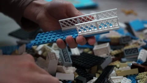 The boy chooses the items scattered from the surface, and collects model Stock Footage 146909353