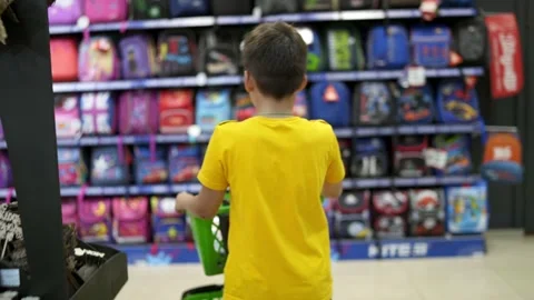 Boy choosing backpack Stock Footage 135988094