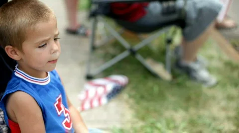 Boy clapping while sitting in stroller Video stock 774495