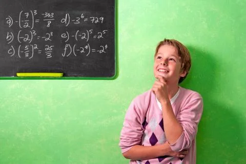 Boy in classroom with wondering expression Stock Photos