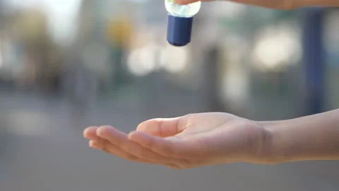 A boy cleaning his hands with antibacterial gel. Stock Footage 130871493