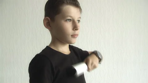 Boy cleans clothes from dirt Stock Footage 68438859