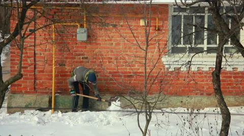 Boy Cleans Snow Stock Footage 34430782