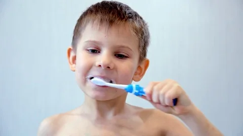 The boy cleans a teeth brush Video stock 73128845