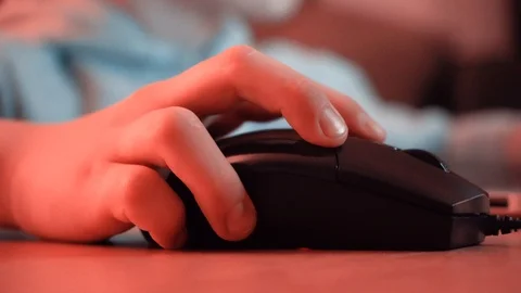 Boy clicking the mouse and typing on keyboard. Child playing games Stock Footage 123211516