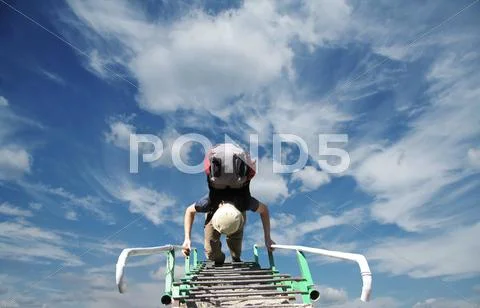 Boy the climb on ledder Stock Photos