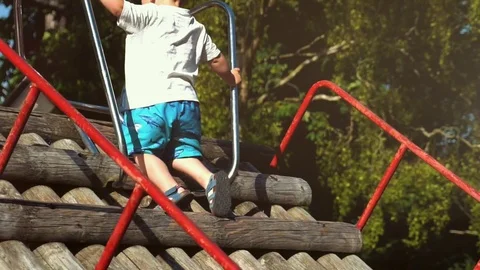Boy climb  the slide  Stock-Footage 79976324