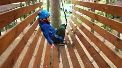 A girl is moving on the rope park's hang, Stock Video