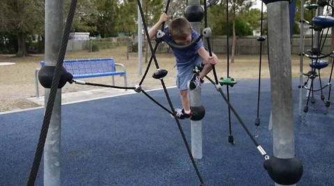 Boy climbing on ladders and cables Stock Footage 10742025