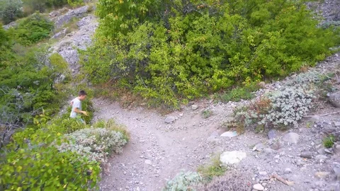 Boy Climbing Mountain Path In Summer Stock Footage 115126456