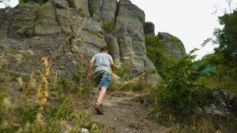 Boy Climbing Mountain Path In Summer Stock Footage 115127182