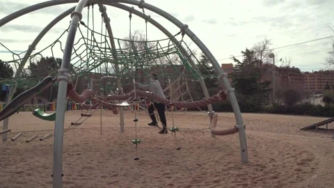 Boy climbing playground structure in Madrid Stock-Footage 304538868