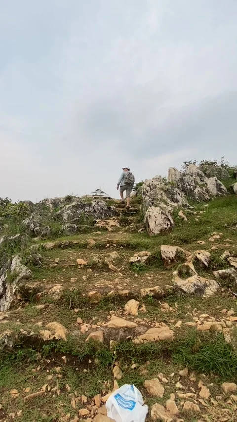 Boy climbing rocks Stock Footage 241817543