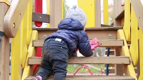 The boy climbs the stairs Video stock 142306418