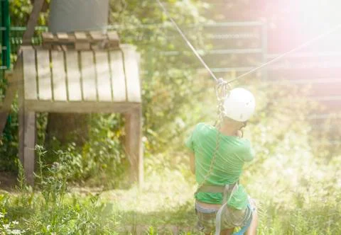 Boy climbs a tree Stock Photos