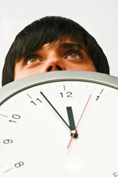 Boy with clock Stock Photos