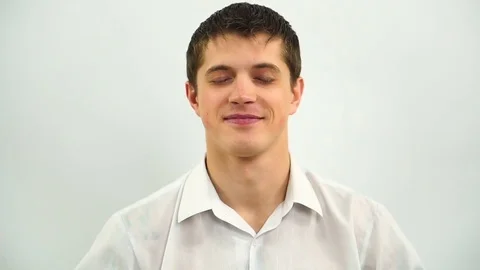 Boy with closed eyes imagining how he do something Stock Footage 72719480