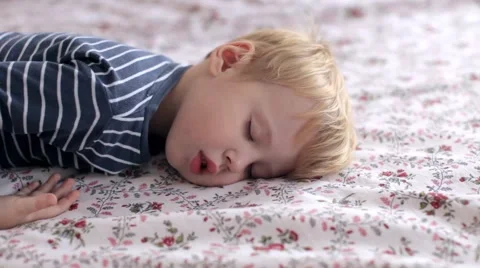 Boy Clothes Sleeps on Tboy Clothes Sleeps on Bed Stock Footage 68311740
