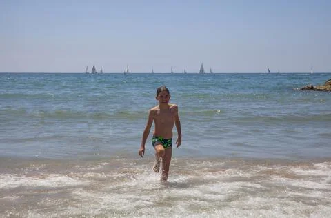 Boy on the coast of the Mediterranean Sea Stock Photos