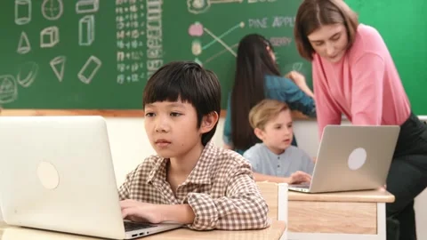 Boy coding engineering prompt while attractive girl drawing picture. Pedagogy. Stock Footage 277911379