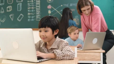 Boy coding engineering prompt while attractive girl drawing picture. Pedagogy. Stock Footage 279893953